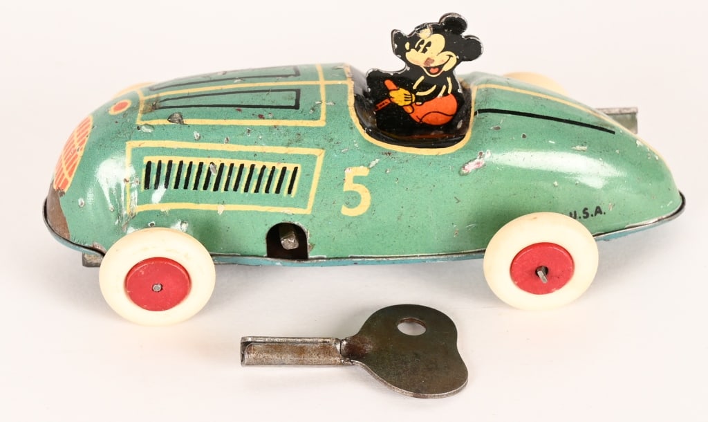 TIN WINDUP MICKEY MOUSE RACE CAR: Great looking car in nice shape. Windup works. Tires are replaced. 3 3/4" Excellent
