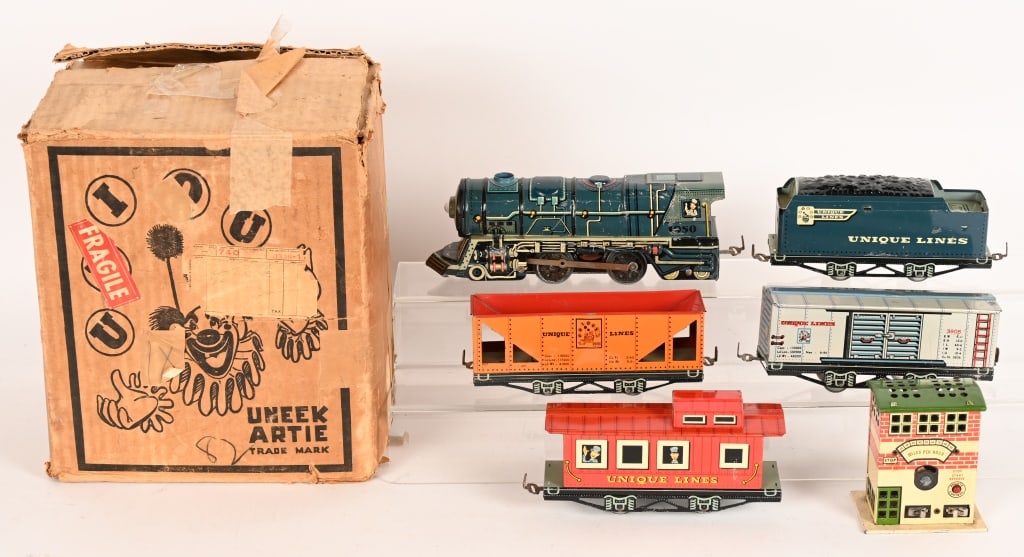 UNIQUE ART ELECTRIC TRAIN SET w/ BOX: Unique Art electric Train Set. Includes Engine and Tender with 3 Cars. Comes with Transformer and Track. With Box. 12" excellent
