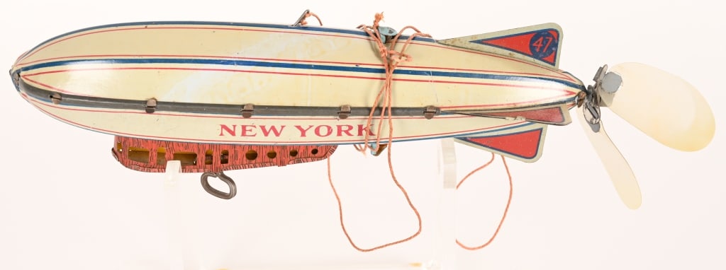 STRAUSS TIN WINDUP NEW YORK ZEPPELIN: Strauss tin windup New York Zeppelin. All original in nice condition. Works. 11" Excellent