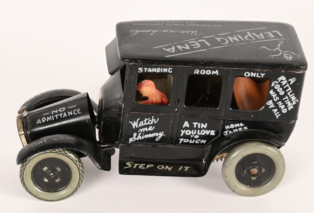 STRAUSS TIN WINDUP LEAPING LENA: Strauss tin windup Leaping Lena. All original in clean condition. Windup works. 8" Excellent