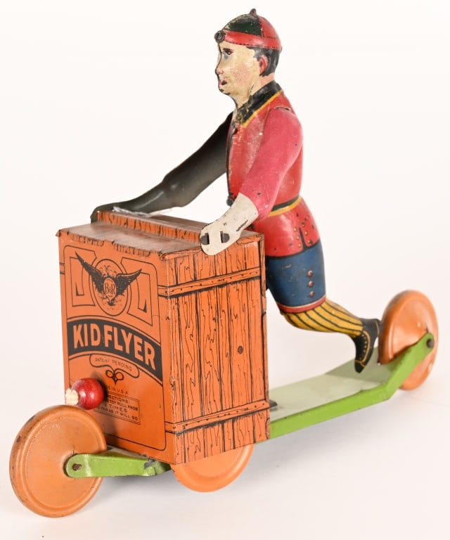 B&R TIN WINDUP KID FLYER: All original in great shape. Works. 8 1/2" Excellent