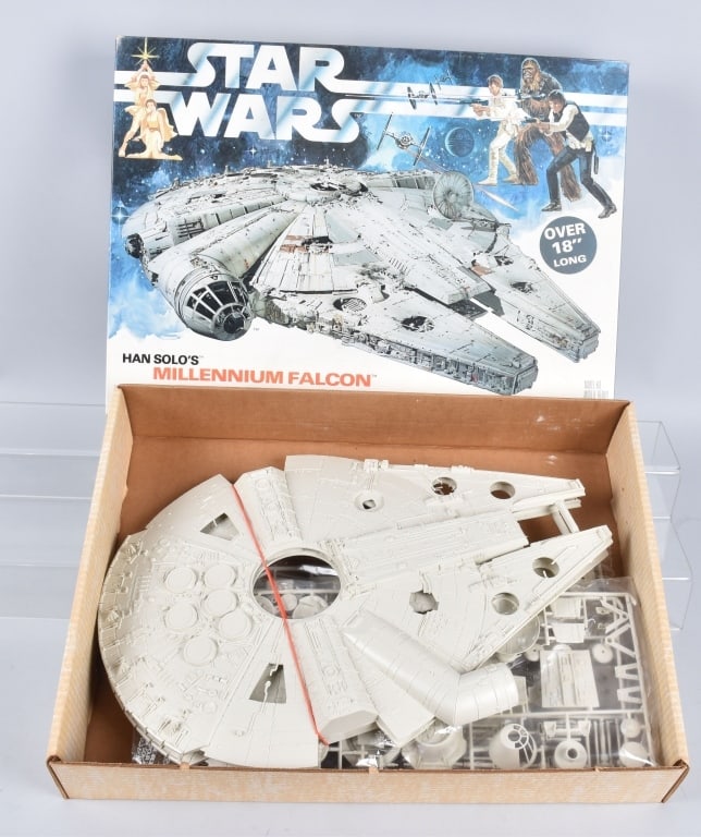 1979 MPC MILLENNIUN FALCON ILLUMINATED MODEL KIT: 1979 Star Wars Han Solo's Millennium Falcon illuminated Model Kit. All complete and never assembled. Pieces still in bags. With crisp box. Model is over 18" long. Excellent