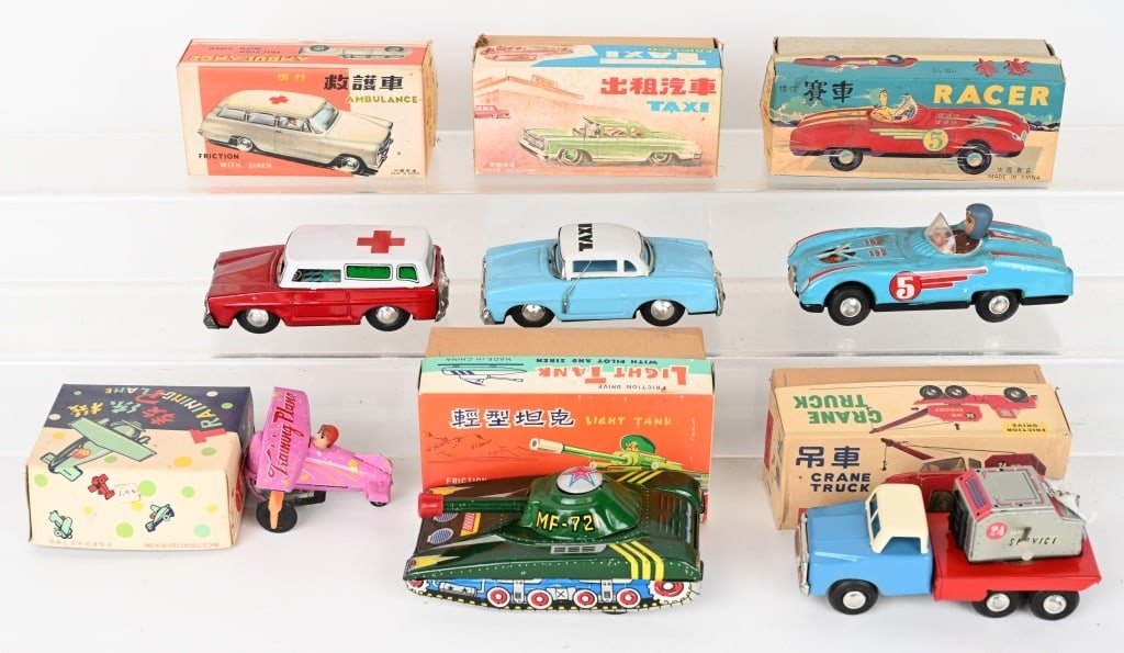 6- RED CHINA TIN TRANSPORTATION TOYS w/ BOX: Includes Racer, Tank, Airplane, Crane Truck, Ambulance, and Taxi. All original and working. Boxed. Largest 6 1/2" Excellent