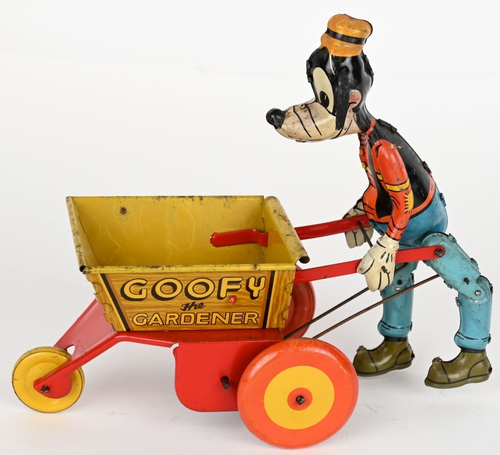 MARX TIN WINDUP GOOFY THE GARDNER: Made in Great Britain. Desirable toy in decent condition. Windup works. Ears replaced. 9" Very Good