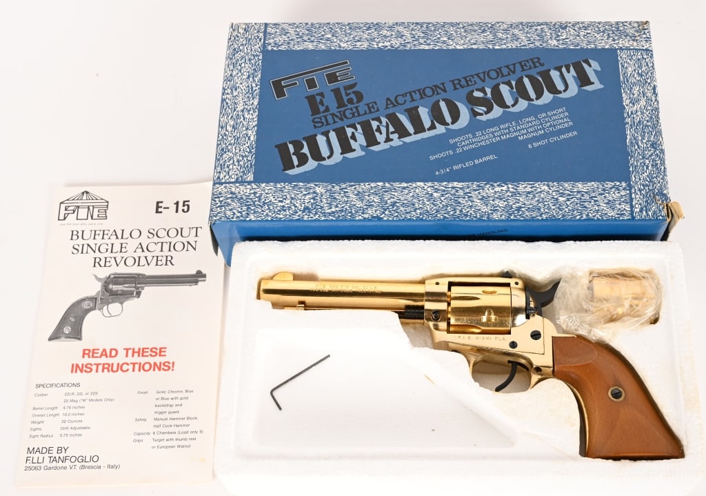 FIE MODEL E15 BUFFALO SCOUT SINGLE ACTION 22/22MAG: SERIAL NUMBER: TC40879 BARREL: 4 3/4" CALIBER: 22 LR - 22 MAG. MANUFACTURED: 1986 - 1990 Made in Italy and imported by F.I.E. Metal is GOLD finished with black hammer, trigger cylinder axel and rear s