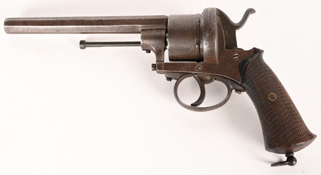 BELGIAN PINFIRE 6 SHOT, 11MM REVOLVER: SERIAL NUMBER: NSN, BARREL: 6" . CALIBER: 11MM MFG: Mid 1800's. The pinfire revolver was a popular sidearm during the Civil War. This example has a long 6" barrel, with checkered walnut grips. CONDITI
