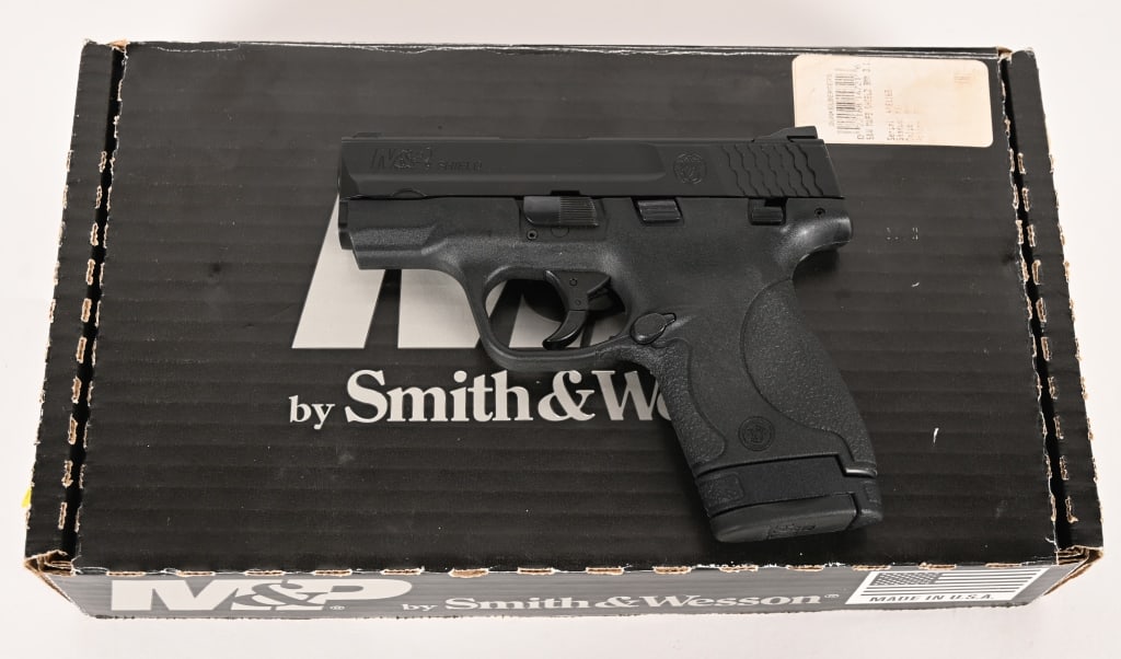 SMITH & WESSON M&P 9 SHIELD SEMI AUTO W/BOX: SERIAL NUMBER: HYe1169. BARREL: 3". CALIBER: 9MM. The M&P 9 shield features a black light weight polymer frame, matte blued steel slide, textured grips, 3-dot windage adjustable front and rear sights