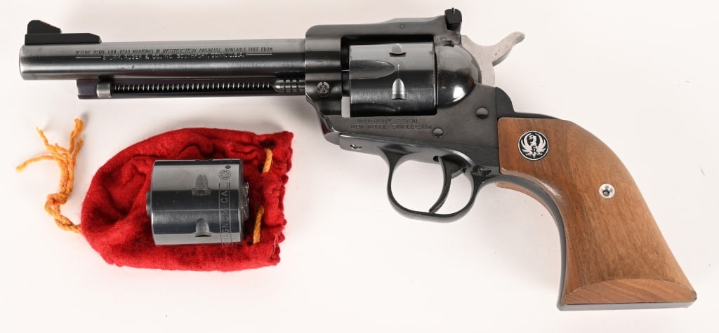 RUGER NEW MODEL SINGLE SIX CONVERTABLE 22LR/22WMR: SERIAL NUMBER: 66-14737. BARREL: 5 1/2". CALIBER: .22 LR / .22 WIN MAGNUM. MANUFACTURED: 1978. This 6 shot revolver features two cylinders (22LR and 22WMR) for fast and easy conversion between caliber