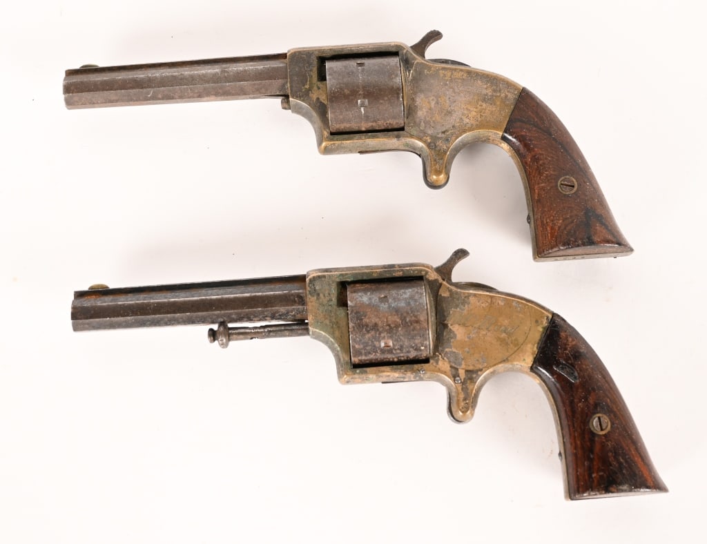 2- ANTIQUE EAGLE ARMS .30 CALIBER REVOLVERS: SERIAL NUMBERS: 5593, & 7283, BARREL: 3 1/2" CALIBER: .30. Brass frame, spur trigger, octagon barrel marked " Eagle Arms", 6 shot, with rose wood grips. CONDITION: SN: 5523, Action works but will not