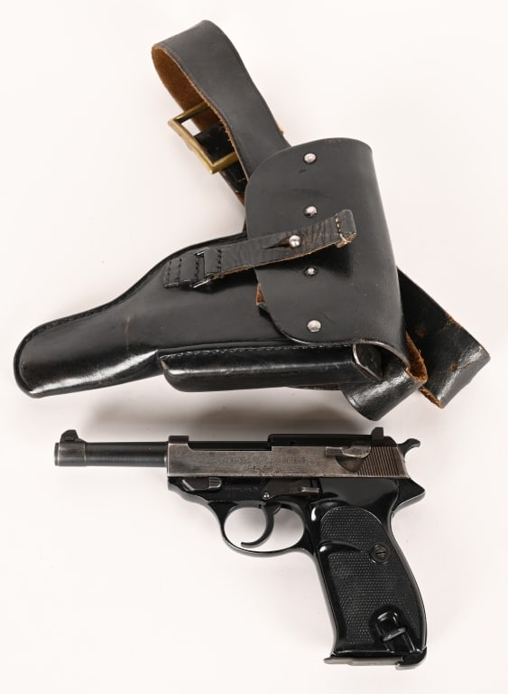 WALTHER P1 SEMI AUTOMATIC PISTOL WITH HOLSTER: SERIAL NUMBER: 241483. BARREL: 5". CALIBER: 9MM LUGER. MANUFACTURED: 1964. Made in Germany. Bundeswehr marks on the frame, slide and barrel. Import marked on the front of the frame. Matching serials o