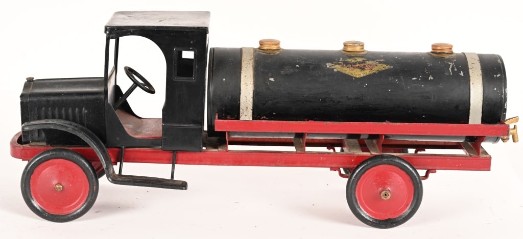 KELMET WHITE TANK TRUCK: Kelmet pressed steel Tank Truck. Nice clean truck that has a nice period repaint. Shows patina and give appearance as original paint. A very hard to find truck in any condition. Displays great. 25" Ve