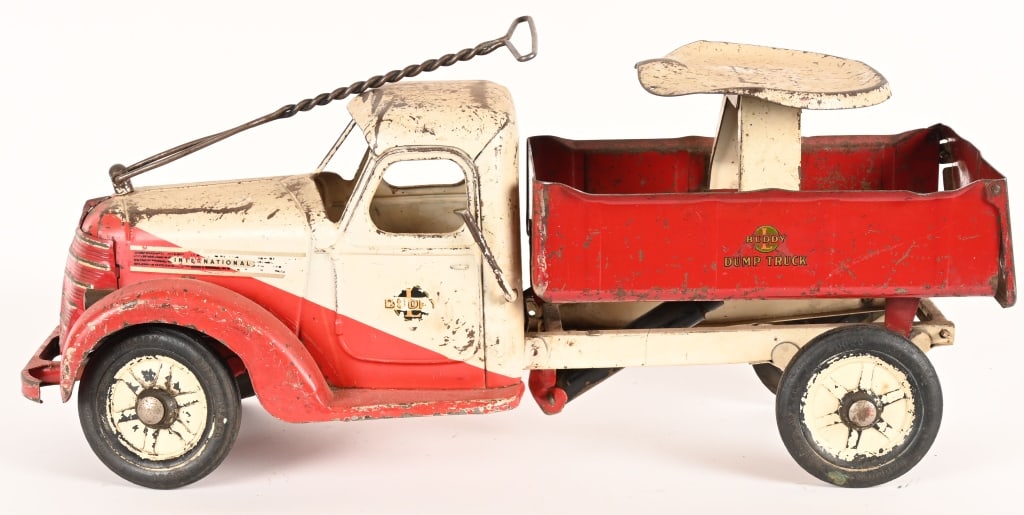 1938 BUDDY L RIDE-ON DUMP TRUCK: 1938 Buddy L Ride-On Dump Truck. All original and complete. Has some wear. One front wheel is loose but present. 26" Very Good