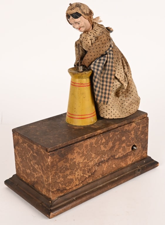 IVES CLOCKWORK LADY WITH BUTTER CHURN: Ives clockwork Lady with Butter Churn. Circa 1870s. All original in amazing condition. All wood construction. Woman has her original outfit. Clockwork not working. A very rare and wonderful toy. 10"