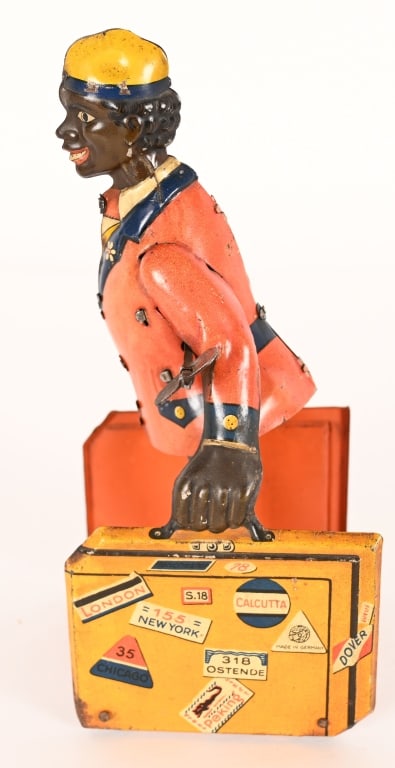 DISTLER TIN WINDUP PORTER WITH LUGGAGE: German tin windup Porter with Luggage. All original and complete. Windup works. 7 1/2" Excellent