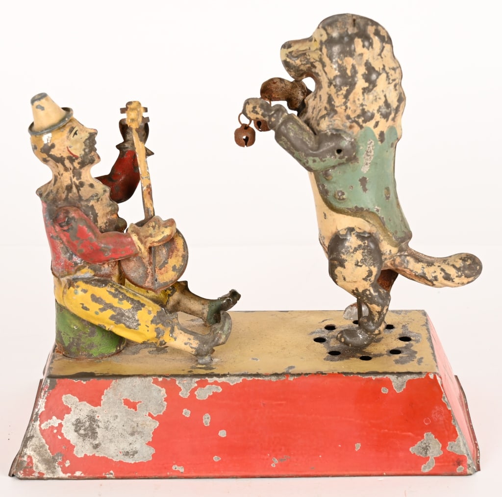 GUNTHERMANN HAND PAINTED TIN WINDUP CLOWN & DOG: German hand painted tin windup Musical Clown with Dancing Dog. Very large impressive toy. Wonderful design. Mostly original with clown having 1 professionally replaced are and a few spots of very mino