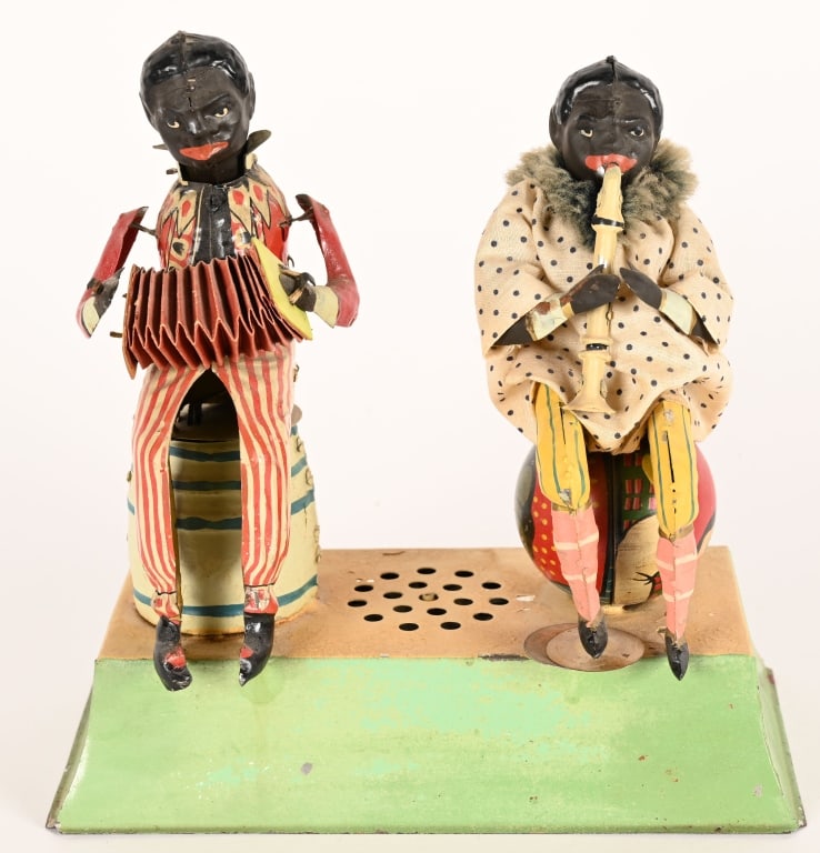 GUNTHERMANN HAND PAINTED TIN CLOWN MINSTRELS: German hand painted tin windup Clown Minstrels. Very large and beautiful toy. Professionally restored. Windup works and has plink plunk sound. Squeeze box is loose from one hand but still displays fin