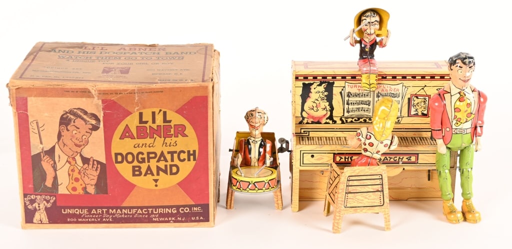 A CHRISTMAS STORY MOVIE UNIQUE ART LIL ABNER BAND: Unique Art tin windup Lil Abner Band with Box. This toy was used in the production of the "A Christmas Story" movie in 1983. These original vintage toys were used in the Higbee Department Store