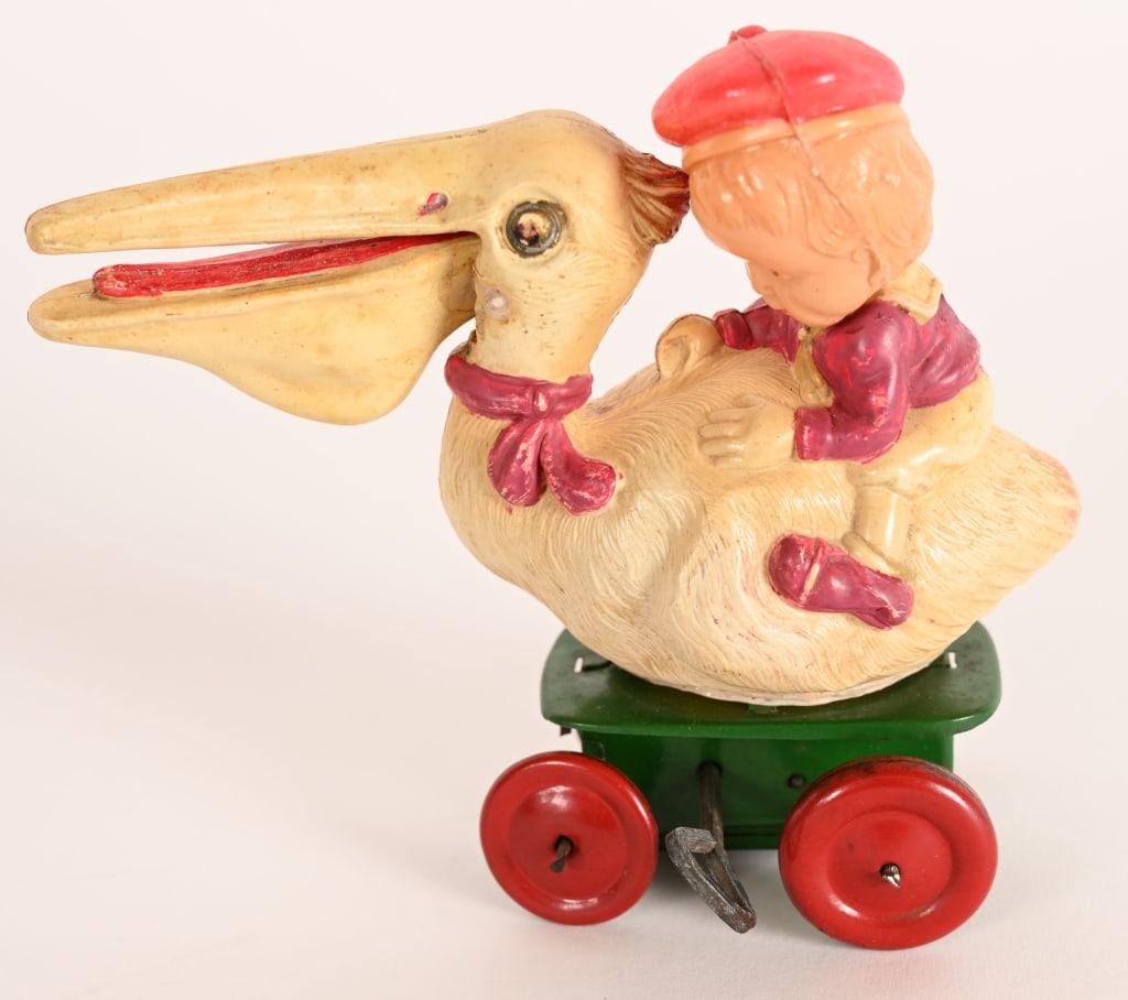 PRE-WAR JAPAN CELLULOID WINDUP GIRL ON PELICAN (1 of 5)