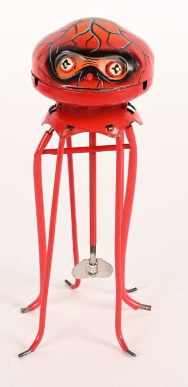 HISHIMO TIN WINDUP MARTIAN: Japan tin windup Martian. One of the rarest space toys out there! This example is all original and in wonderful condition. The colors are nice and bright. The windup works well. The toy has unique wal