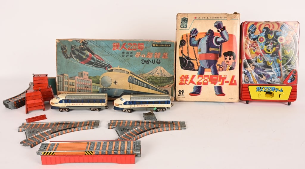 JAPAN TETSUJIN TRAIN SET & PACHINKO w/ BOX: Includes Japan Tetsujin Pachinko with Box and Tetsujin battery operated Train set with Track. Both have some wear. With Boxes. Largest 18" Very Good-Excellent