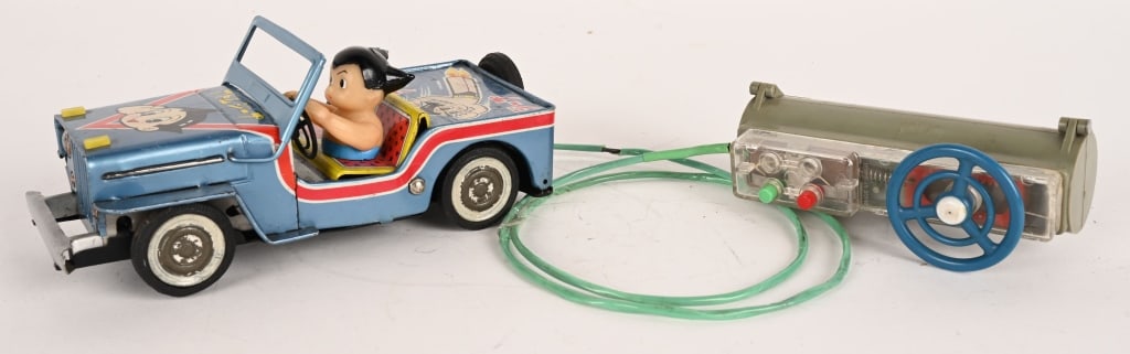 BANDAI BATTERY OP ASTRO BOY JEEP: Japan battery operated Astro Boy Jeep. All original with great graphics. Nice clean condition. Has correct battery box remote control. Did not work when tested. Very hard to find toy. 8" Excellent