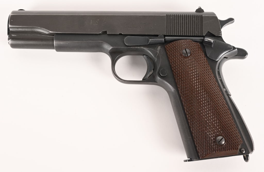 WW2 ERA 1943 REMINGTON RAND 1911A1 45 ACP PISTOL: SERIAL NUMBER: 1080337 BARREL: 5" CALIBER: 45 ACP. MANUFACTURED: 1943. Original finish with UNITED STATES PROPERTY M 1911 A1 U.S. ARMY. on the right side of the frame. Two line Remington address on