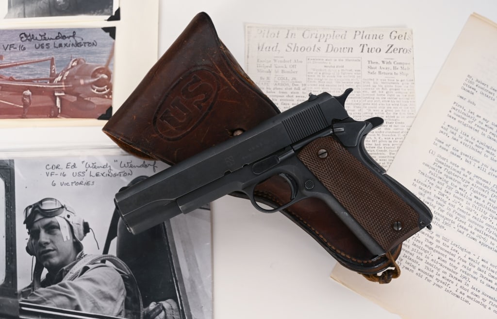 HISTORIC NAVY FIGHTER PILOTS UNION SWITCH & SIGNAL: SERIAL NUMBER: 1058170. BARREL: 5”. CALIBER: .45 ACP. MANUFACTURED: 1943. This exceptional and historically important Union Switch & Signal 1911A1 was issued to and carried by Naval Aviator and