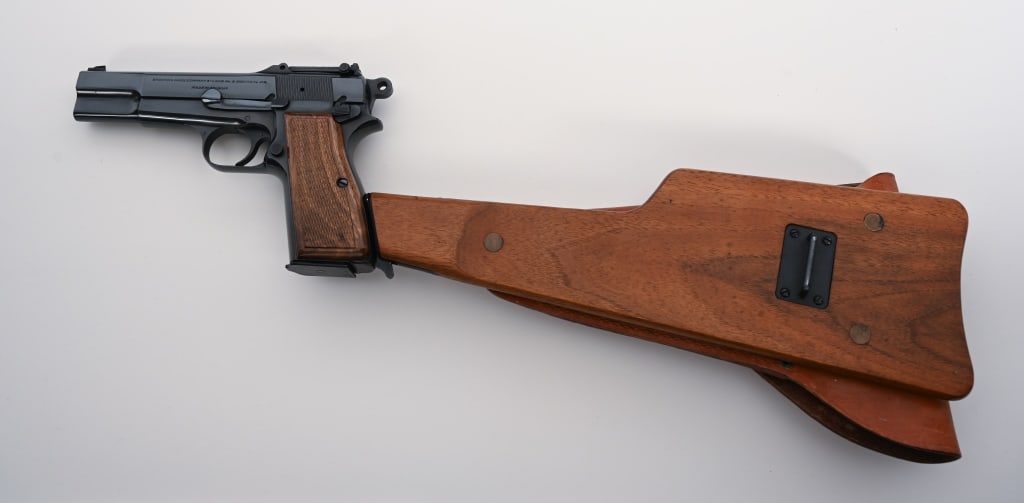 ONLY KNOWN ISRAELI ISSUED STOCKED HI POWER MINT: SERIAL NUMBER: T215958. BARREL: 5”. CALIBER: 9MM. MANUFACTURED: 1968. The Browning factory records confirm this is one of only ten examples ever built as test-samples for the Israeli Military.