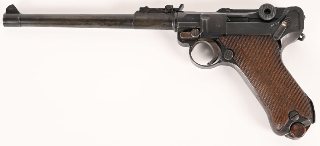 IMPERIAL GERMAN 1918 DATED LP.08 ARTILLERY LUGER: SERIAL NUMBER: 4533c. BARREL: 7-3/4". CALIBER: 9MM LUGER. MANUFACTURED: 1914. "1914" dated chamber. "DWM" marked toggle. Imperial proofs on the right side of the chamber. No import/export marks.