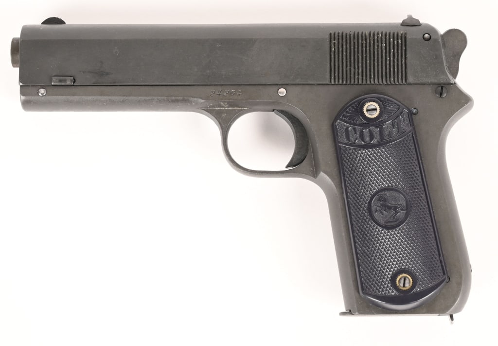 COLT MODEL 1903 POCKET HAMMER IN 38 RIMLESS: SERIAL NUMBER: 24204 BARREL: 4 1/2" CALIBER: .38 AUTO MANUFACTURED: 1909. A continuation of the Model 1902 in a more compact variation with shorter barrel. Blue finish with 2 piece checkered hard