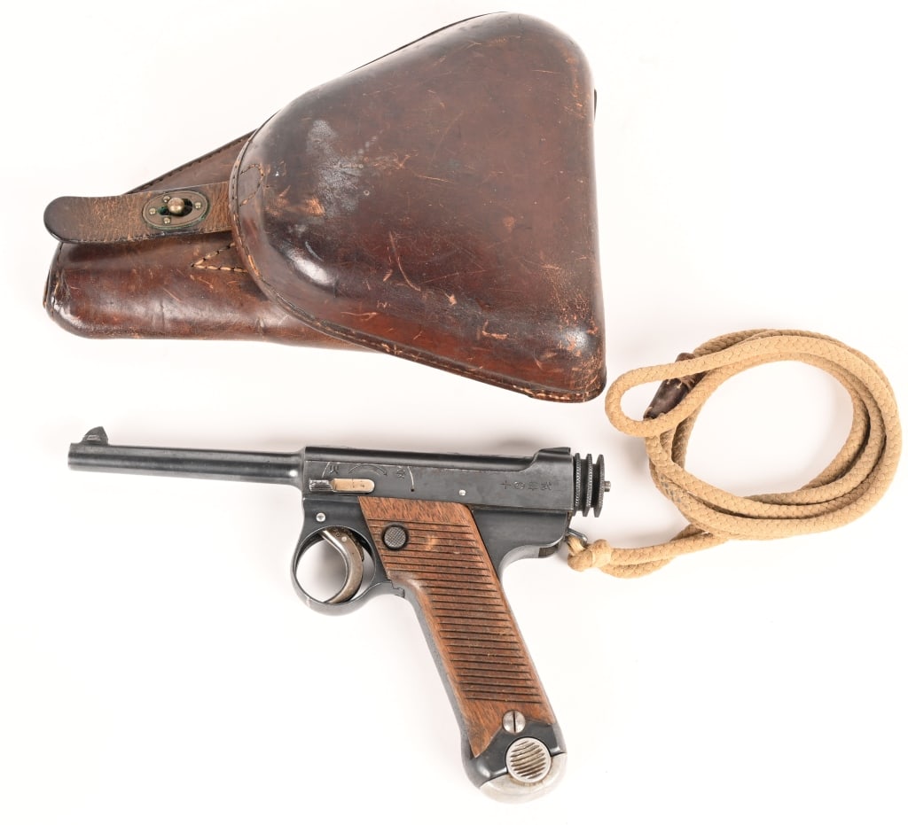 WW2 JAPANESE TYPE 14 NAMBU PISTOL WITH HOLSTER: SERIAL NUMBER 12248 BARREL 4-5/8" CALIBER 8MM NAMBU MANUFACTURED: June 1935 ( 10.8) . Produced at Kokubunji Factory Tokyo Japan with blue finish, Oil finished grooved wood grip panels and 2 groove