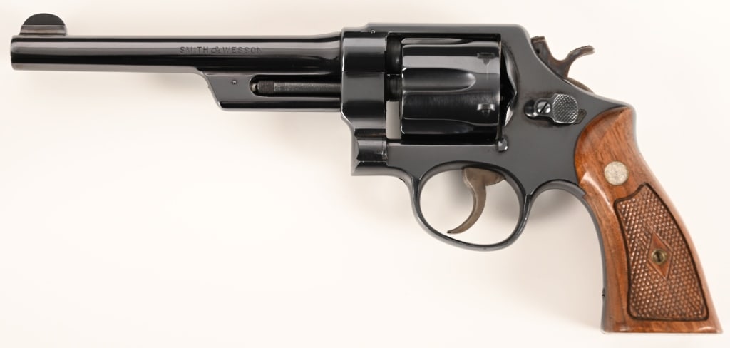 RARE SMITH & WESSON PRE MODEL 20 38/44 HEAVY DUTY: SERIAL NUMBER: S155922 BARREL: Rare 6 1/2" CALIBER: .38 Special MANUFACTURED: 1956. Built on the five screw N-frame this rare Pre Model 20 aka .38/44 Heavy Duty Model of 1950 is equipped with the