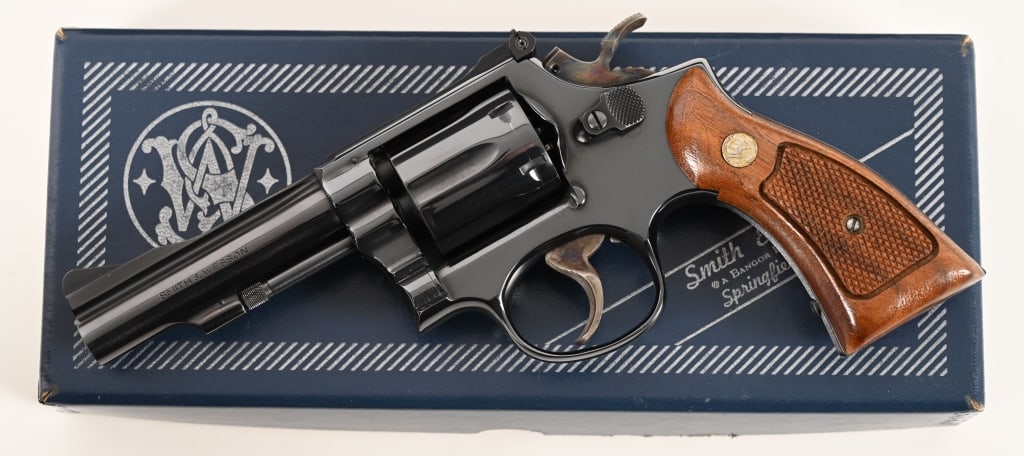 SMITH & WESSON MODEL 15-3 COMBAT MASTERPIECE: SERIAL NUMBER: 6K1367. BARREL: 4”. CALIBER: .38 Special. MANUFACTURED: 1974. This Model 15-3 .38 Combat Masterpiece is standard equipped with a 4” barrel and plain-clothes magna grips.