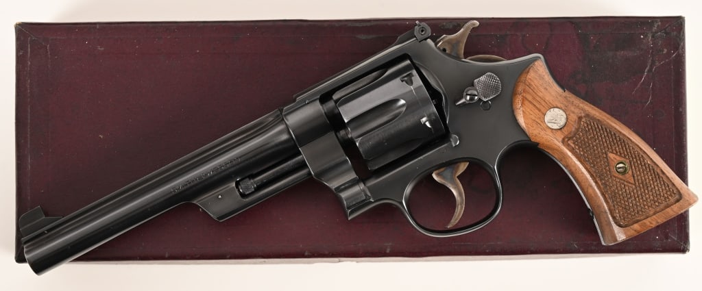 TRANSITION SMITH & WESSON 38/44 OUTDOORSMAN: SERIAL NUMBER: S70086. BARREL: 6 1/2”. CALIBER: .38 Special. MANUFACTURED: 1947. One of only 2326 built this investment grade .38/44 Outdoorsman Transition is equipped with a 6 1/2” barrel