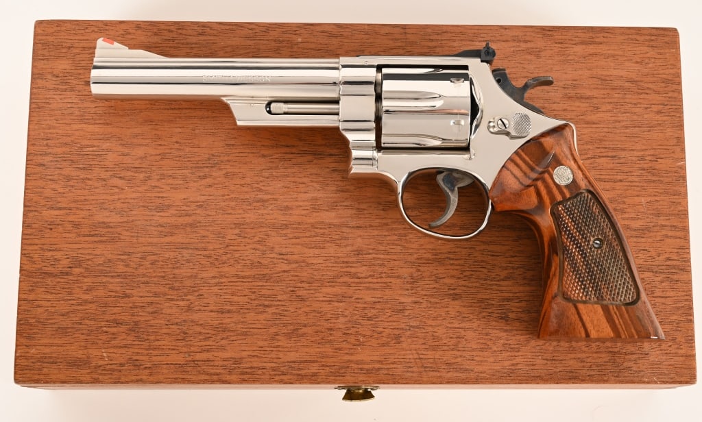 SMITH & WESSON MODEL 29-2 4 MAGNUM ANIB: SERIAL NUMBER: N724537. BARREL: 6”. CALIBER: .44 Magnum. MANUFACTURED: 1980. Complete in the original mahogany display case with the factory tools and paperwork this wonderful and investment gra