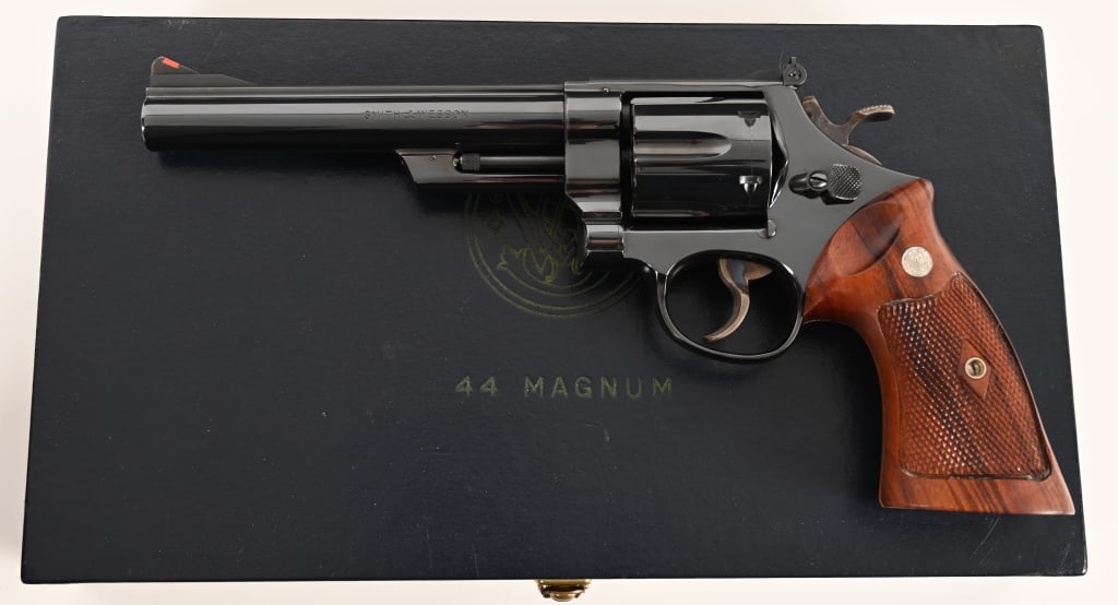 SMITH & WESSON PRE MODEL 29 4-SCREW 1957 ANIB: SERIAL NUMBER: S174322. BARREL: 6 1/2”. CALIBER: .44 Magnum. MANUFACTURED: 1957. Built on the four screw N-frame this Pre Model 29 .44 Magnum comes complete in the equally mint smooth black pres