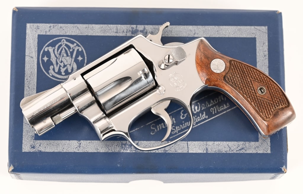 1ST YEAR BRIGHT STAINLESS MODEL 60 SMITH & WESSON: SERIAL NUMBER: 409838. BARREL: 2”. CALIBER: .38 Special. MANUFACTURED: 1965. Built in the first year of production, just outside of the first 39 ever originally assembled, this second run Model
