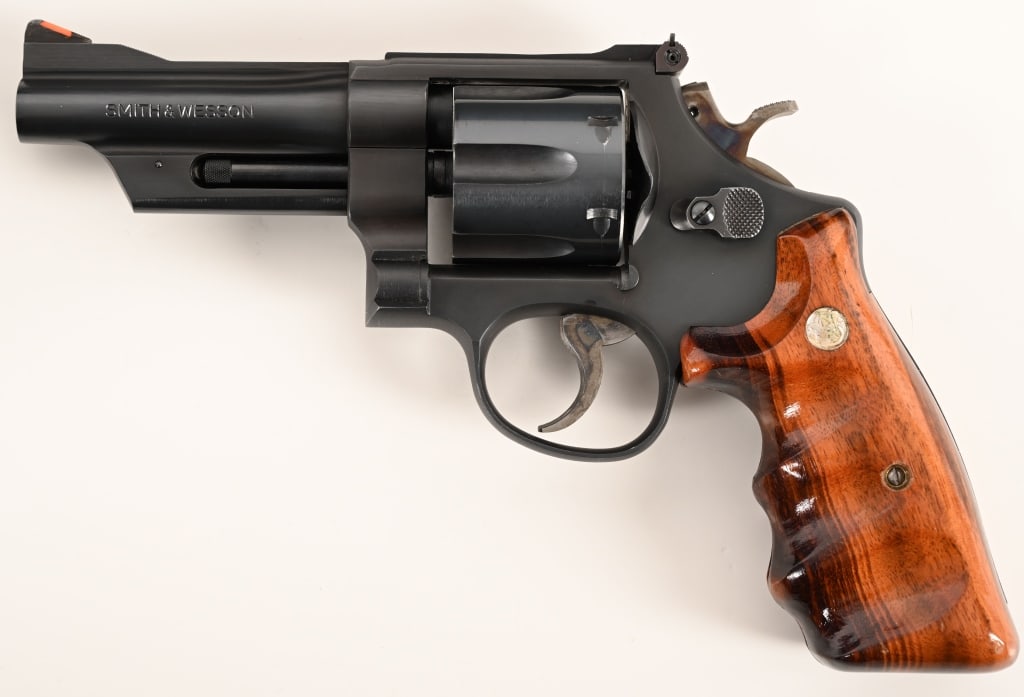 SMITH & WESSON MODEL 28-3 357 HIGHWAY PATROLMAN: SERIAL NUMBER: N955194. BARREL: 4”. CALIBER: .357 Magnum. MANUFACTURED: 1983. This special ordered Model is equipped with a 4” barrel, original satin blue finish, checkered walnut magna