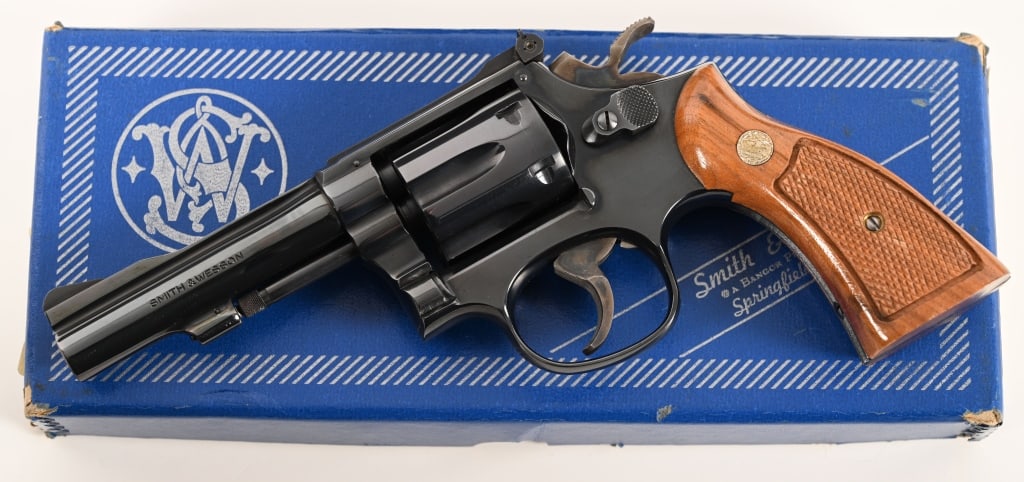 SMITH & WESSON MODEL 18-4 K22 COMBAT MASTERPIECE: SERIAL NUMBER: 92K2581. BARREL: 4”. CALIBER: .22 LR. MANUFACTURED: 1981. This Model 18-4 .22 Combat Masterpiece comes complete in the original numbers matching box with the paperwork. Note the