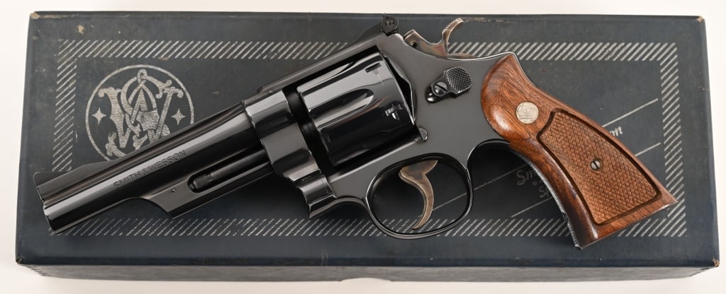 SMITH & WESSON MODEL 27-2 357 MAGNUM: SERIAL NUMBER: N51328. BARREL: 5”. CALIBER: .357 Magnum. MANUFACTURED: 1971. This fantastic Model 27-2 is equipped with a 5” barrel, original bright blue finish with checkered walnut