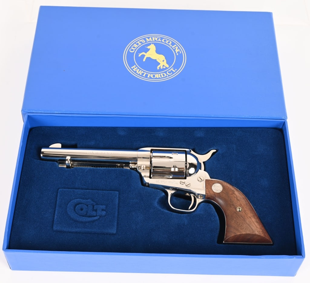 BOXED NICKEL COLT SINGLE ACTION ARMY 3RD GEN: SERIAL NUMBER: SA98198 BARREL: 5 1/2" CALIBER : 44-40 MANUFACTURED: 1992 Made in USA Gen 3. Metal is nickel finish steel with walnut Colt logo grips. Single line address on top of barrel with COLT SIN