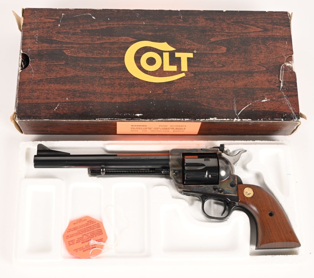 BOXED COLT NEW FRONTIER SINGLE ACTION REVOLVER: SERIAL NUMBER: 01528NF. BARREL: 7.5". CALIBER: 45 COLT. MANUFACTURED: 1979-1980 Made in USA 3rd Gen. Standard target model with flat top frame, adjustable rear sight. Metal is blue finish barrel, cyli