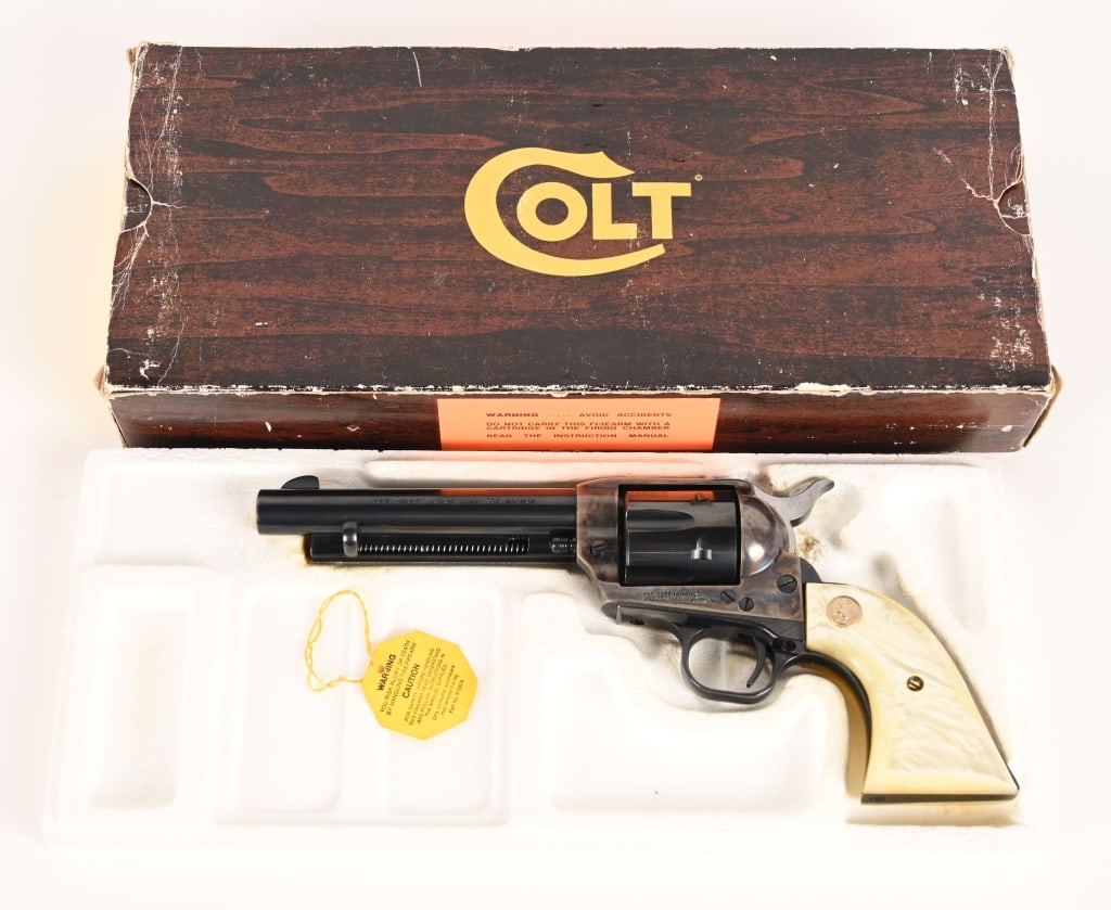 BOXED COLT SINGLE ACTION ARMY 2ND GENERATION 357: SERIAL NUMBER: SA21170 BARREL: 5 1/2" CALIBER: 357 MAGNUM. MANUFACTURED: 1958. Metal is blue steel with case color frame and polished hammer. Single line address on top of the barrel with COLT SINGLE