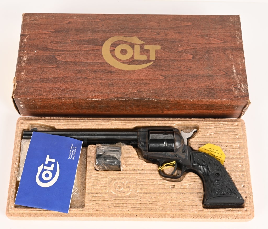 BOXED COLT PEACEMAKER SINGLE ACTION 22 LR.: SERIAL NUMBER: G138594 BARREL: 7 1/2" CALIBER: 22 LR. - 22 MAG. MANUFACTURED: 1975 Made in the USA. Metal is blue finish with cases hardened frame and standard sights. Colt's single line address on