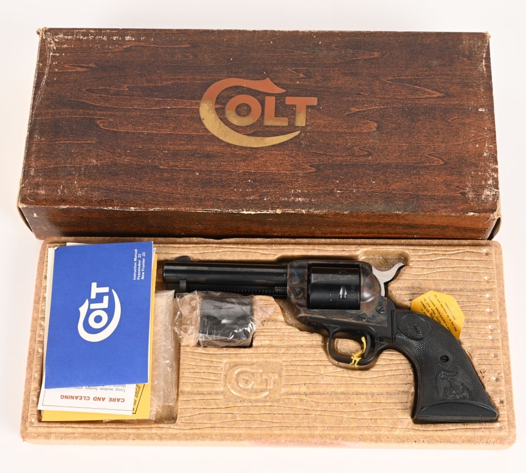 BOXED COLT PEACEMAKER SINGLE ACTION 22 LR.: SERIAL NUMBER: G108904 BARREL: 4 3/8" CALIBER: 22 LR. - 22 MAG. MANUFACTURED: 1974 Made in the USA. Metal is blue finish with cases hardened frame and standard sights. Colt's single line address on