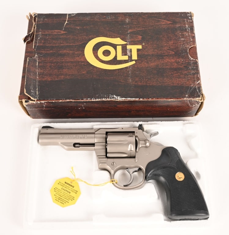 BOXED COLT TROOPER MK III ELECTROLESS NICKEL 357: SERIAL NUMBER: 22158U BARREL: 4" CALIBER: 357 MAGNUM MANUFACTURED: 1980-1981 Made in the USA. Metal is electro-less nickel finish with adjustable rear sight and ramped front. Colt logo Pachmayr