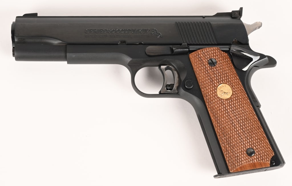 COLT GOLD CUP NATIONAL MATCH SERIES 80 .45 ACP: SERIAL NUMBER: FN11473 BARREL: 5 " CALIBER: 45 ACP MANUFACTURED: 1984 Made in the USA. Metal is blue finish with adjustable target style sights. Wide adjustable polished trigger and polished hammer.