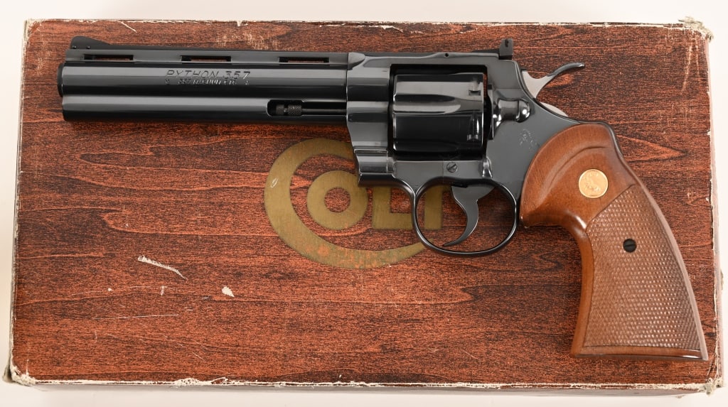 1975 COLT PYTHON 6" ORIGINAL BOX 357 MAGNUM: SERIAL NUMBER: 01686E. BARREL: 6”. CALIBER: .357 Magnum. MANUFACTURED: 1975. Complete in the original numbers matching wood grain one piece box this investment grade Colt Python is equipped
