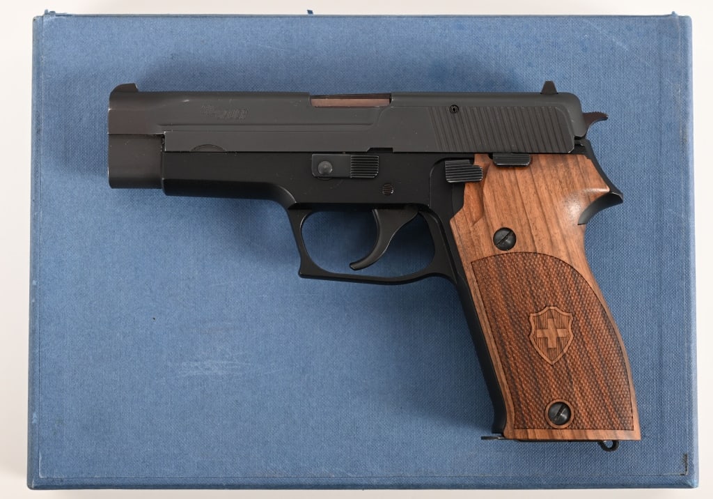 SIG SAUER P220 9MM BLUE BOX NICE!: SERIAL NUMBER: G106486. BARREL: 4.5". CALIBER: 9mm. MANUFACTURED: 1977. Complete in the original one piece blue box this fantastic Sig P220 will have a special place in any collection. CONDITION: The