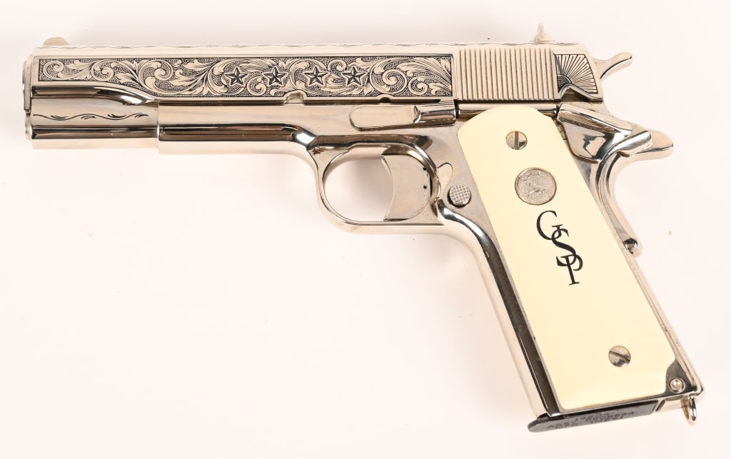 AMERICA REMEMBERS COLT 1911 GEORGE PATTON: SERIAL NUMBER: 2849368. BARREL: 5". CALIBER: .45 ACP. MANUFACTURED: 2012. This fine 1911 Classic Government (P110C) features high finish nickel-plated with white Ivory like grips. Floral scroll-engrav